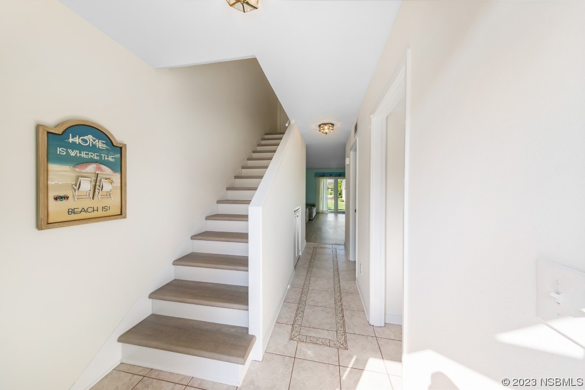 4790 South Atlantic Avenue, Unit F601 Ponce Inlet, FL 32127 - Photo 19 of 37 a view of a hallway with staircase