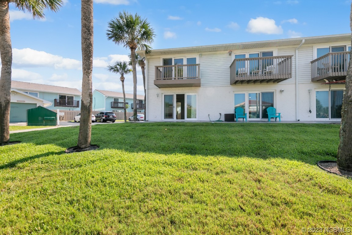 4790 South Atlantic Avenue, Unit F601 Ponce Inlet, FL 32127 - Photo 20 of 37 a view of building with yard