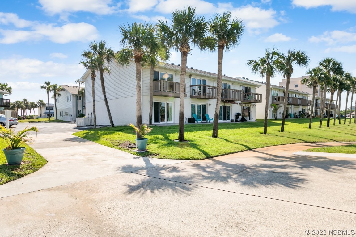 4790 South Atlantic Avenue, Unit F601 Ponce Inlet, FL 32127 - Photo 2 of 37 a view of a palm trees in a park
