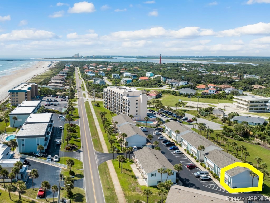 4790 South Atlantic Avenue, Unit F601 Ponce Inlet, FL 32127 - Photo 34 of 37 an aerial view of residential building and lake