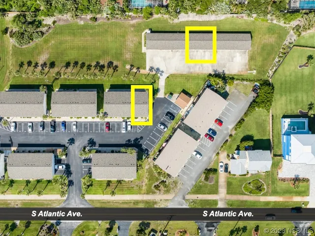 a view of a livingroom with furniture and windows