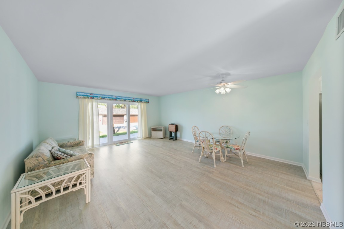 4790 South Atlantic Avenue, Unit F601 Ponce Inlet, FL 32127 - Photo 7 of 37 a view of a livingroom with furniture and windows