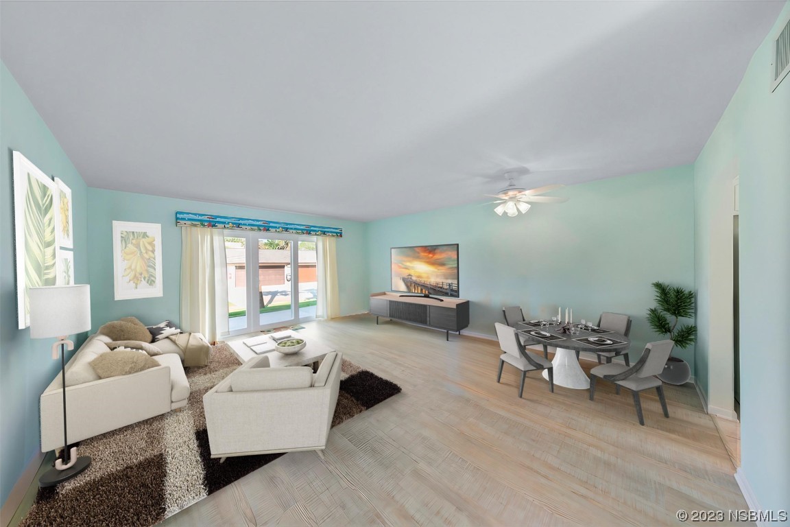 4790 South Atlantic Avenue, Unit F601 Ponce Inlet, FL 32127 - Photo 8 of 37 a living room with furniture and a flat screen tv