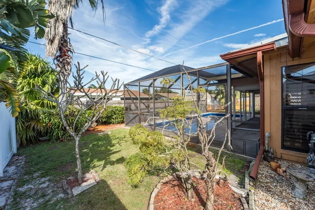 a view of a yard with table and chairs