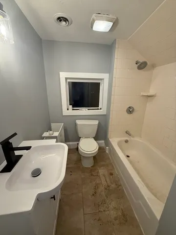 a bathroom with a sink a toilet and a bathtub