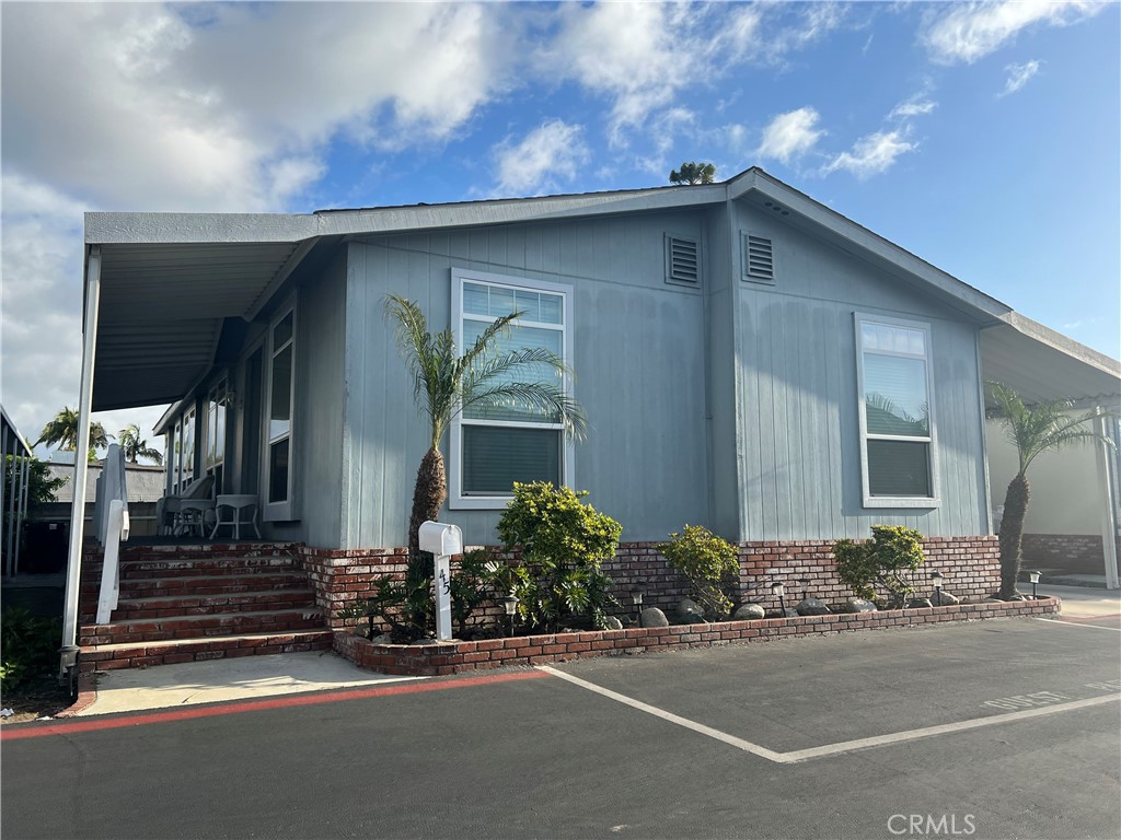 3050 West Ball Road, Unit 45 Anaheim, CA 92804 - Photo 1 of 1 a front view of a house with a yard