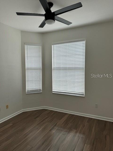 13584 Turtle Marsh Loop, Unit 132 Orlando, FL 32837 - Photo 18 of 21 a view of an empty room with wooden floor and a window
