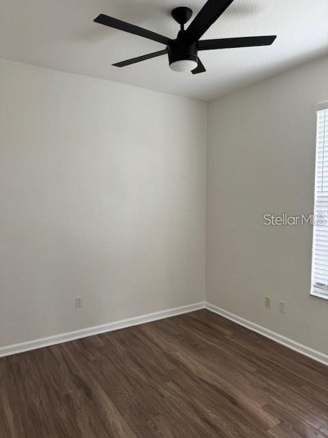 13584 Turtle Marsh Loop, Unit 132 Orlando, FL 32837 - Photo 19 of 21 a view of a small space with wooden floor a ceiling fan and a window