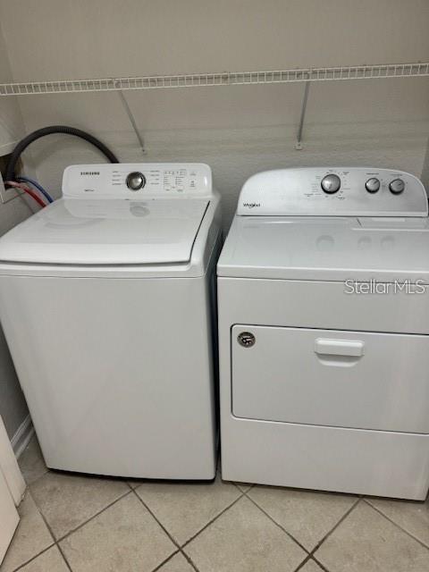 13584 Turtle Marsh Loop, Unit 132 Orlando, FL 32837 - Photo 20 of 21 a utility room with dryer and washer