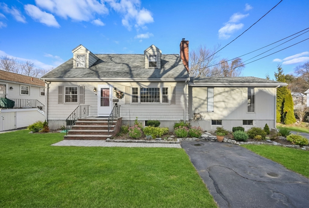 48 Grapevine Avenue Lexington, MA 02421 - Photo 1 of 34 a front view of a house with a garden