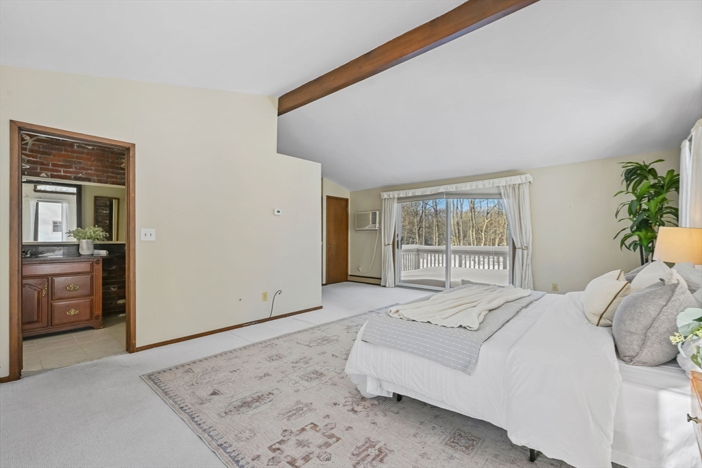 48 Grapevine Avenue Lexington, MA 02421 - Photo 20 of 34 a bedroom with a large bed and a window