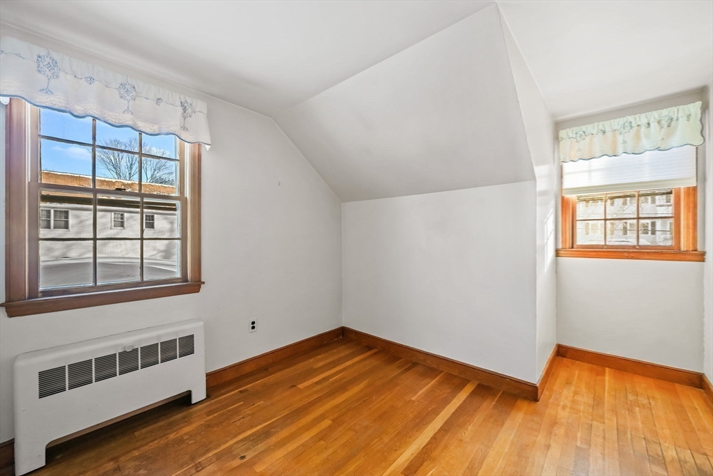 48 Grapevine Avenue Lexington, MA 02421 - Photo 29 of 34 a view of a room with wooden floor and windows