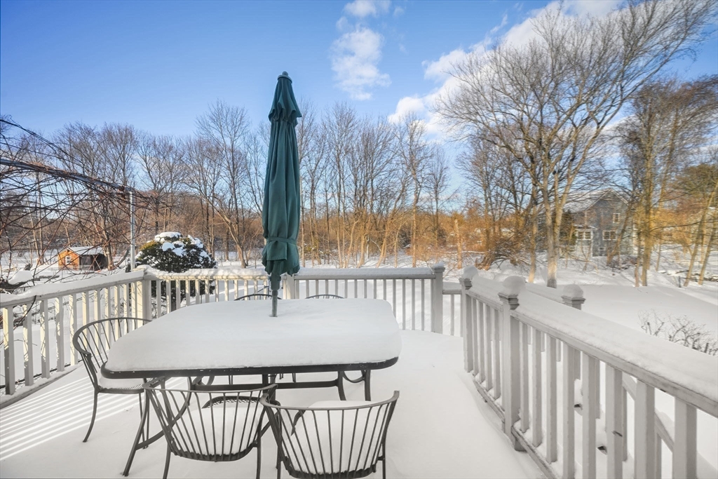 48 Grapevine Avenue Lexington, MA 02421 - Photo 33 of 34 a view of a chairs and table on the deck