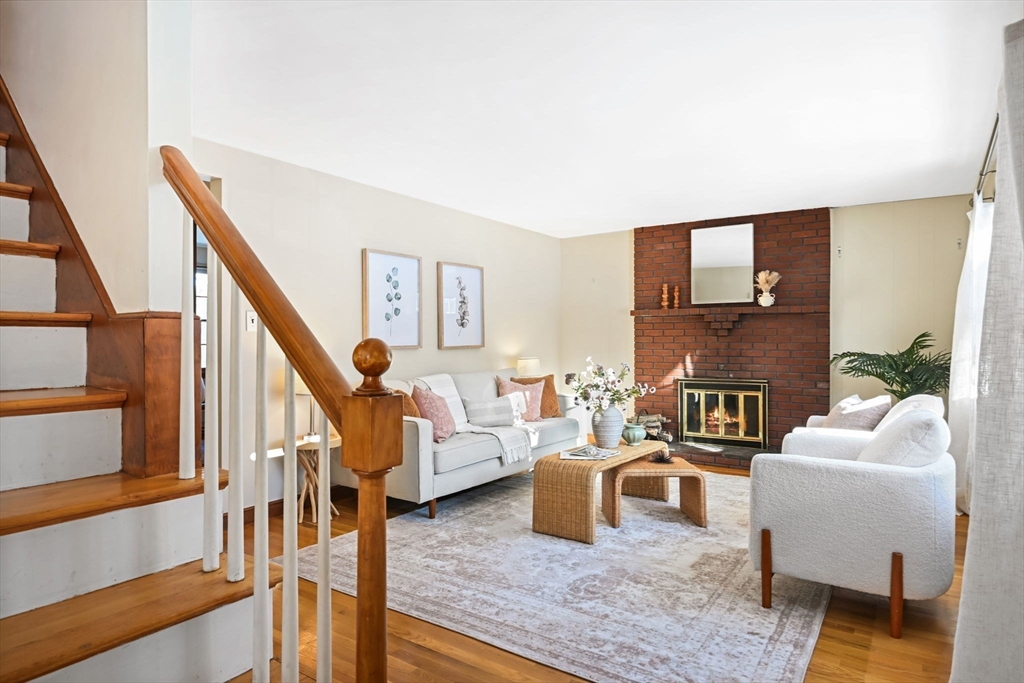 48 Grapevine Avenue Lexington, MA 02421 - Photo 5 of 34 a living room with furniture and a fireplace