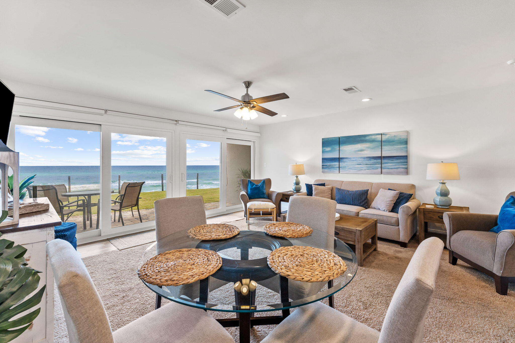 214 Blue Mountain Road, Unit 114 Santa Rosa Beach, FL 32459 - Photo 1 of 39 a living room with furniture a large window and a table
