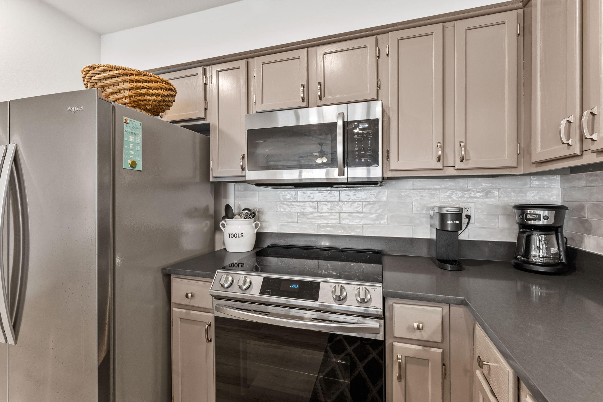 214 Blue Mountain Road, Unit 114 Santa Rosa Beach, FL 32459 - Photo 11 of 39 a kitchen with stainless steel appliances granite countertop a stove a refrigerator and a microwave