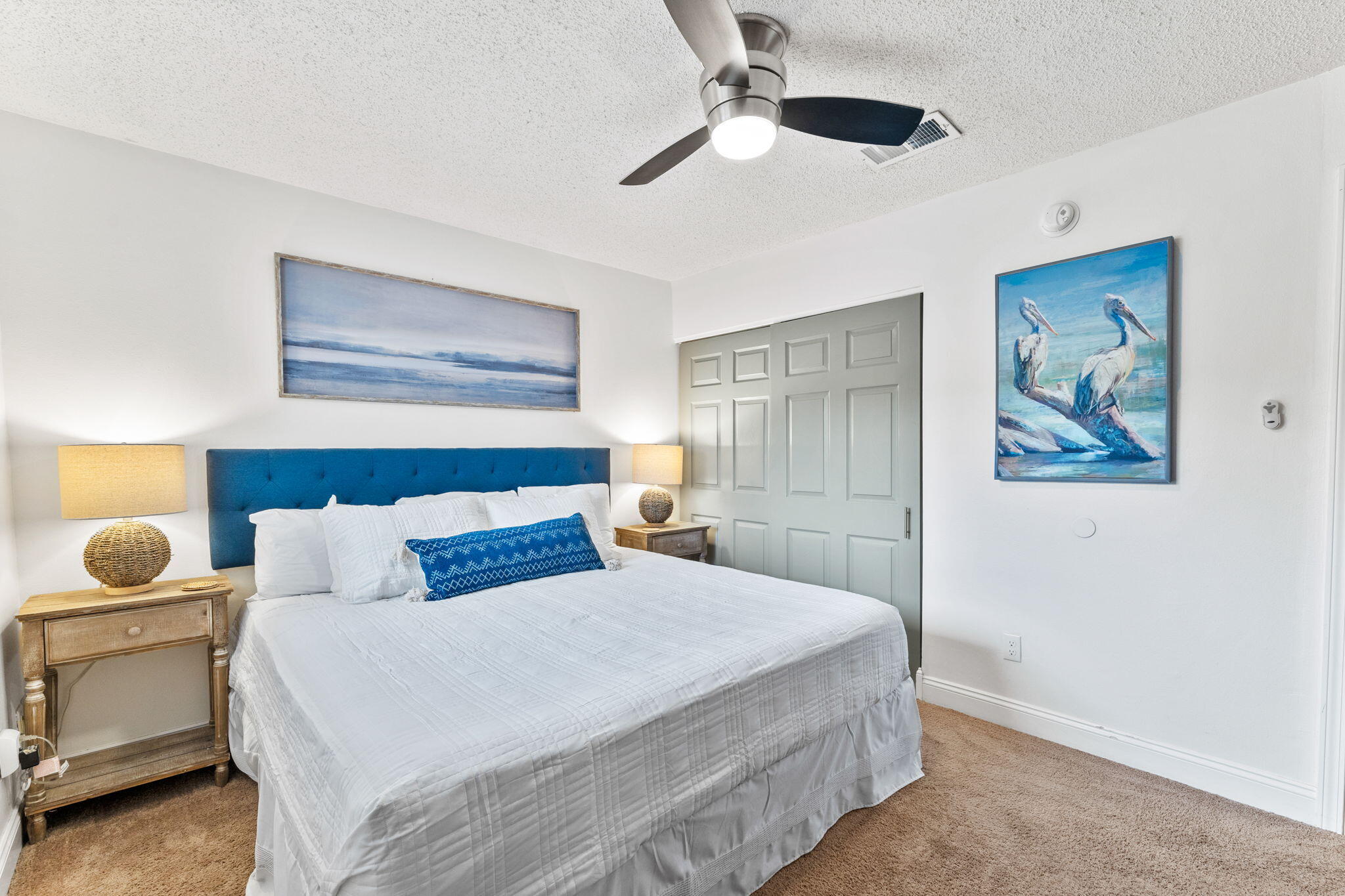214 Blue Mountain Road, Unit 114 Santa Rosa Beach, FL 32459 - Photo 17 of 39 a bedroom with a bed and a painting on the wall