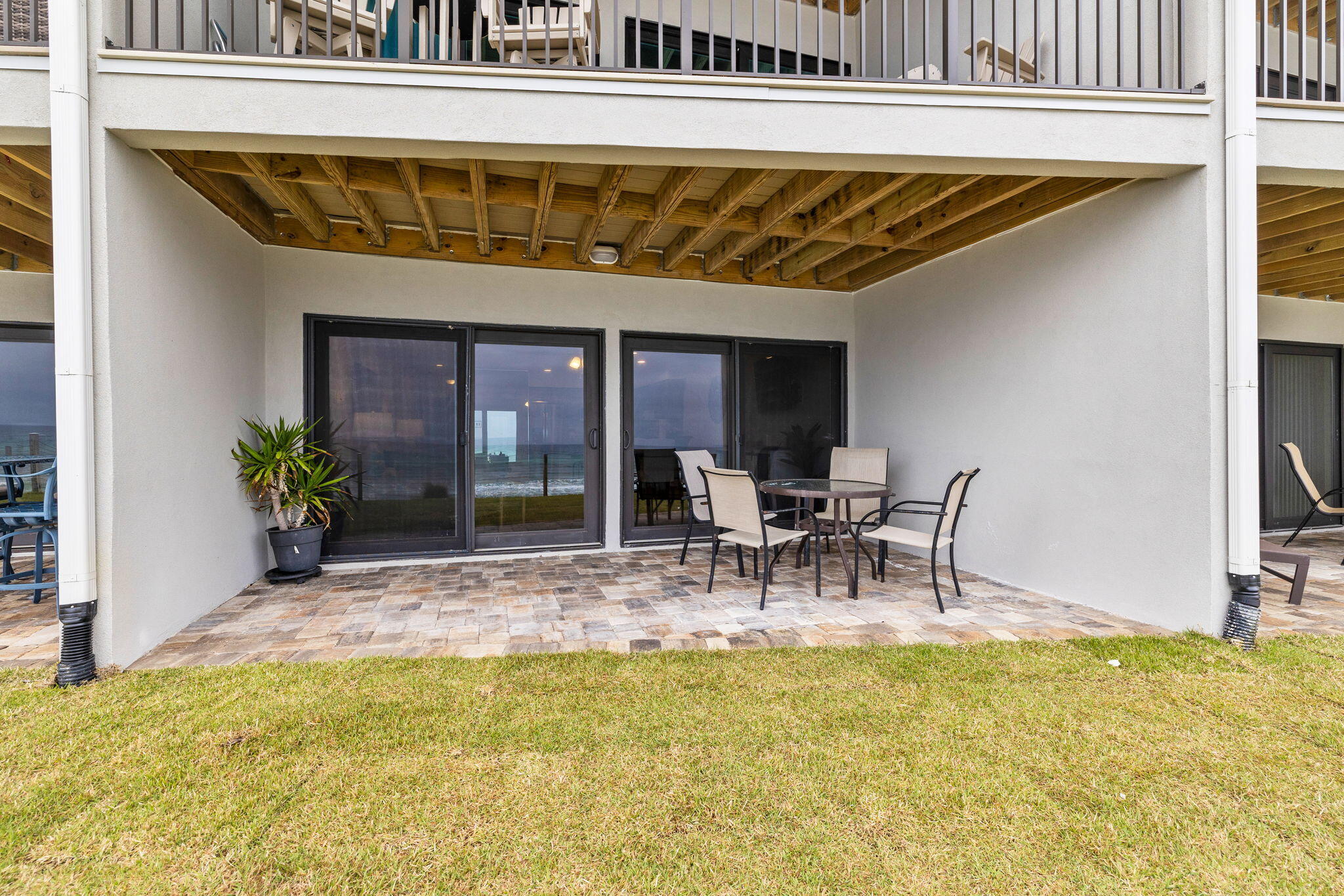 214 Blue Mountain Road, Unit 114 Santa Rosa Beach, FL 32459 - Photo 22 of 39 a view of two chairs and table in the patio