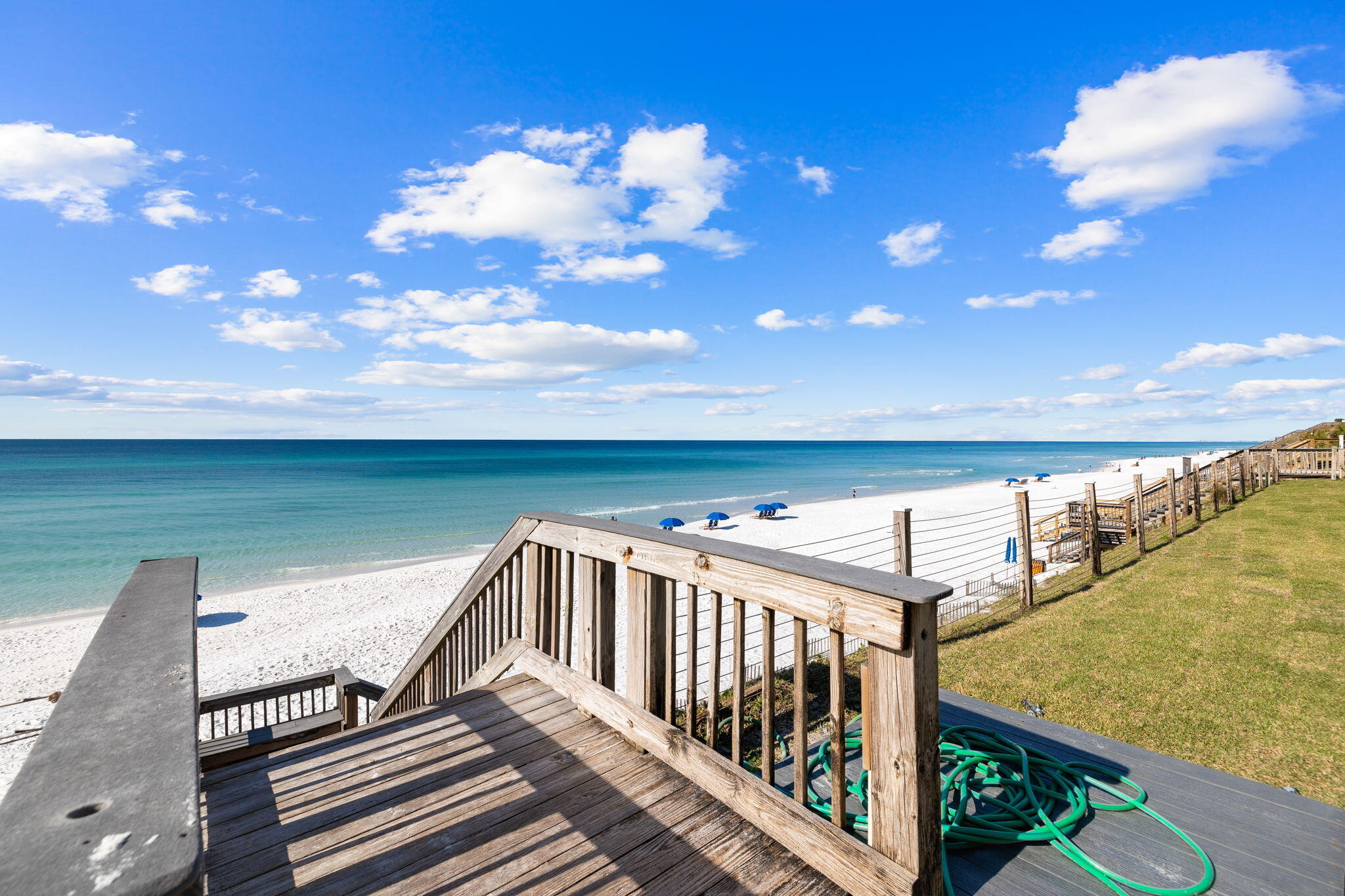 214 Blue Mountain Road, Unit 114 Santa Rosa Beach, FL 32459 - Photo 24 of 39 a view of a balcony with wooden floor and outdoor seating