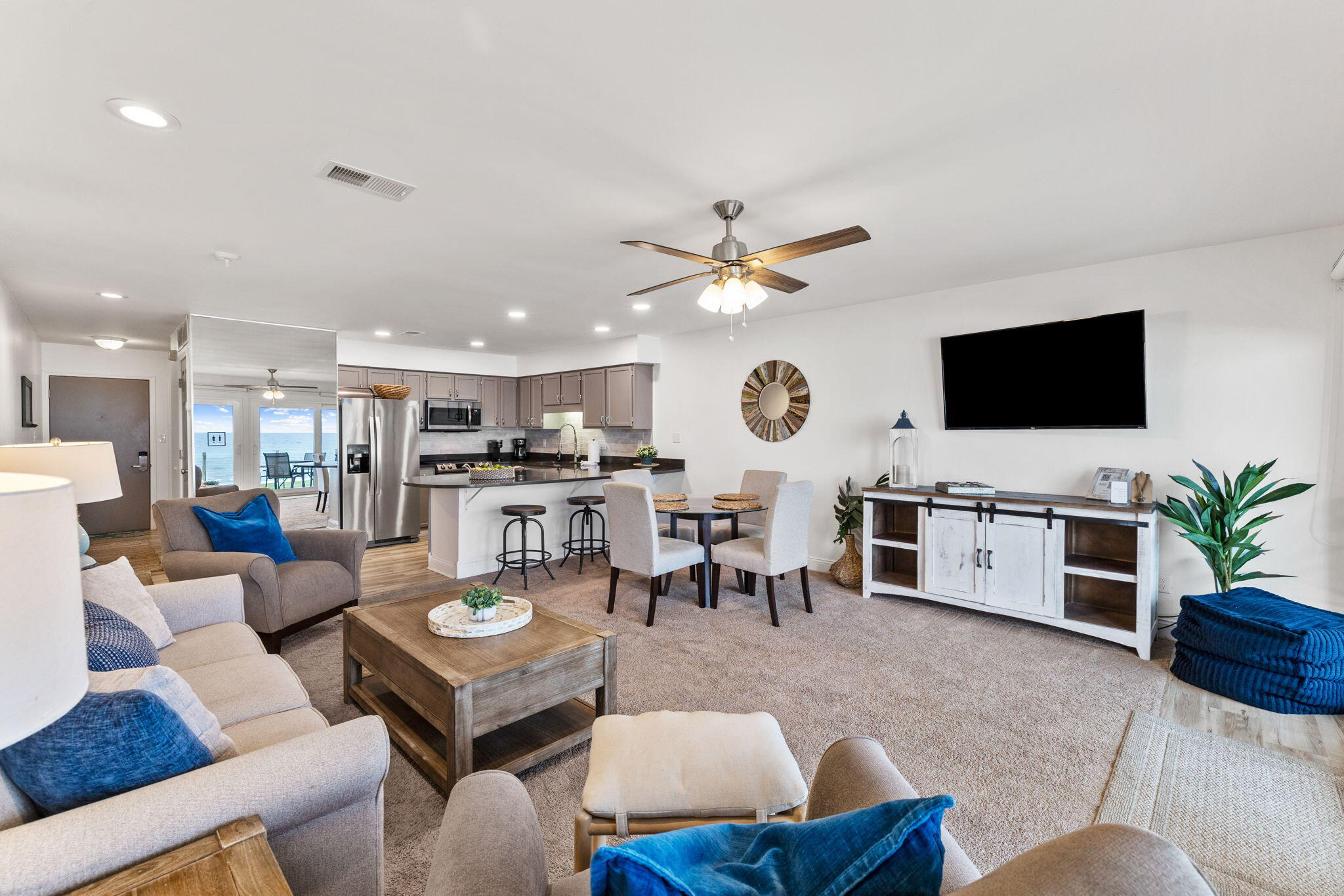 214 Blue Mountain Road, Unit 114 Santa Rosa Beach, FL 32459 - Photo 3 of 39 a living room with furniture kitchen view and a large window