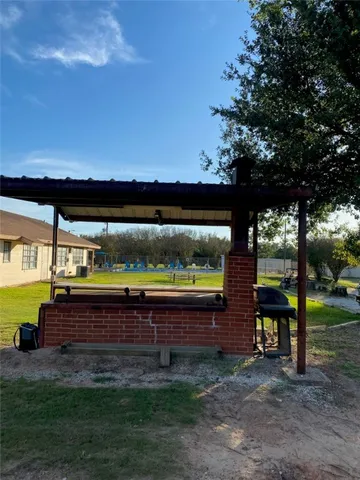 a view of a yard with an outdoor space