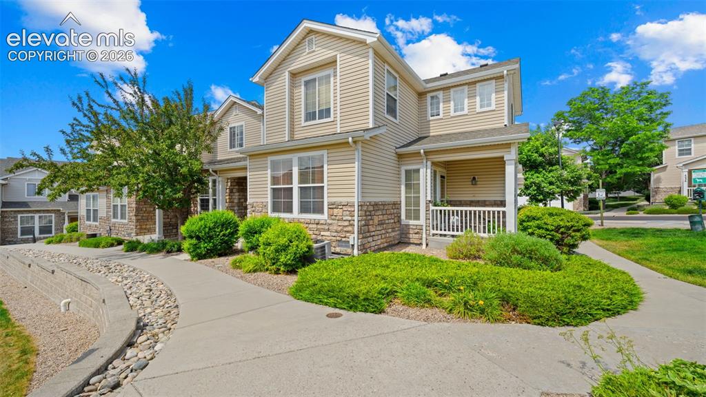 4023 Diamond Ridge View Colorado Springs, CO 80918 - Photo 1 of 31 a front view of a house with a yard