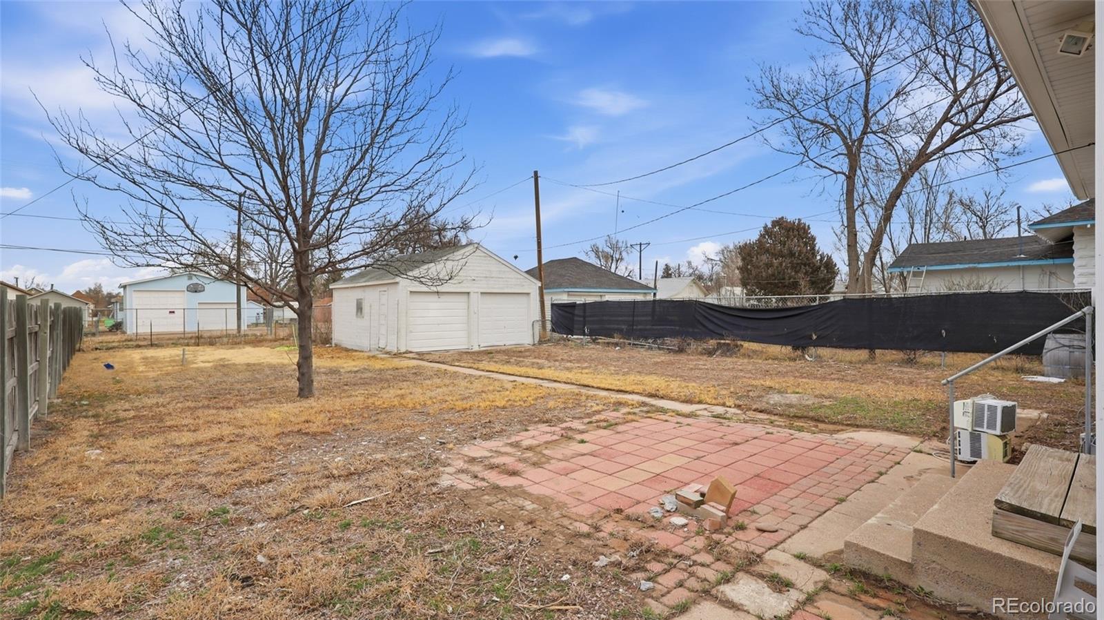 220 State Street Sterling, CO 80751 - Photo 14 of 15 a house with yard covered in snow