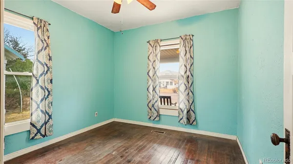a view of a room with rack and wooden floor