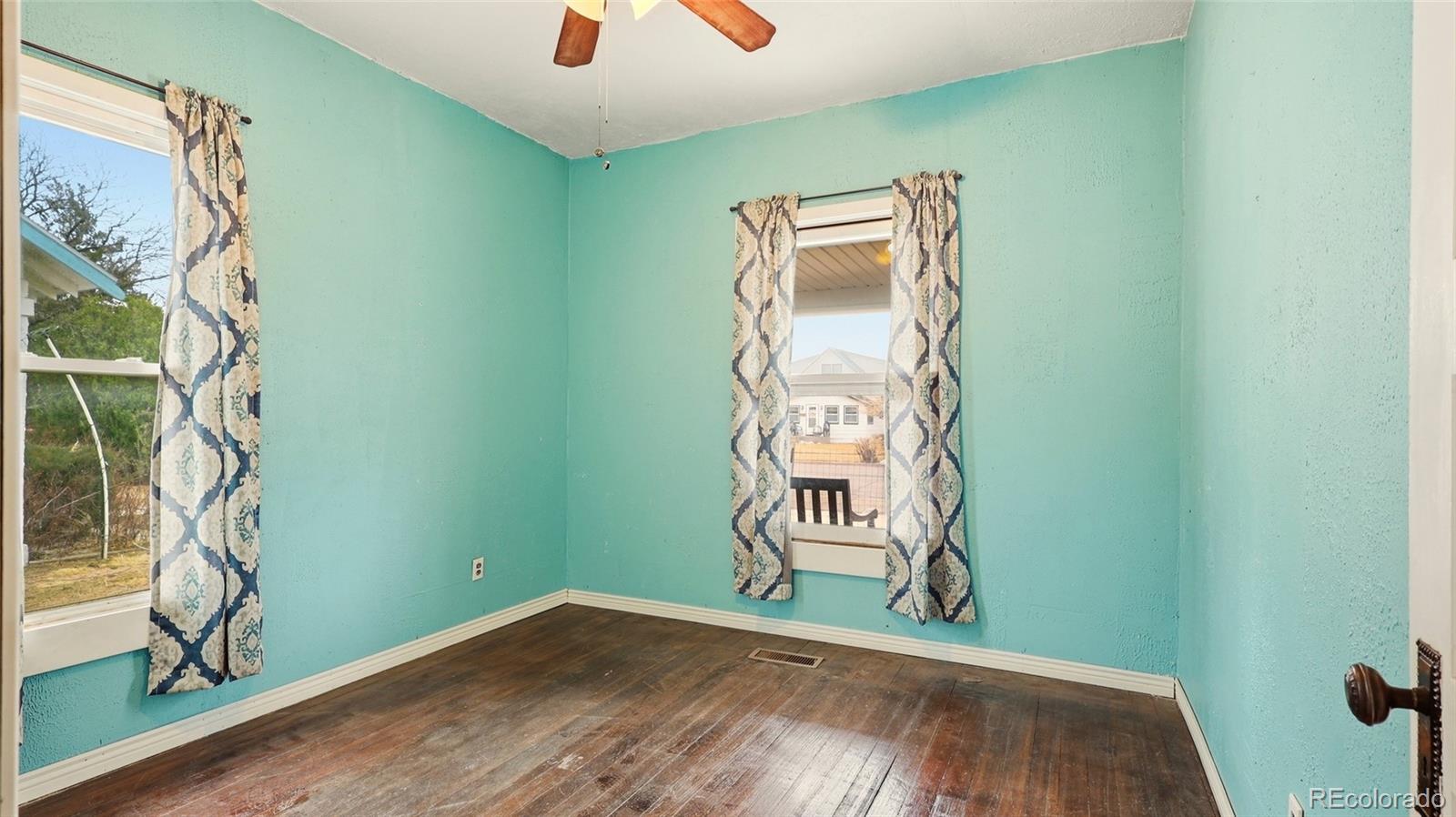 220 State Street Sterling, CO 80751 - Photo 8 of 15 a view of a room with rack and wooden floor