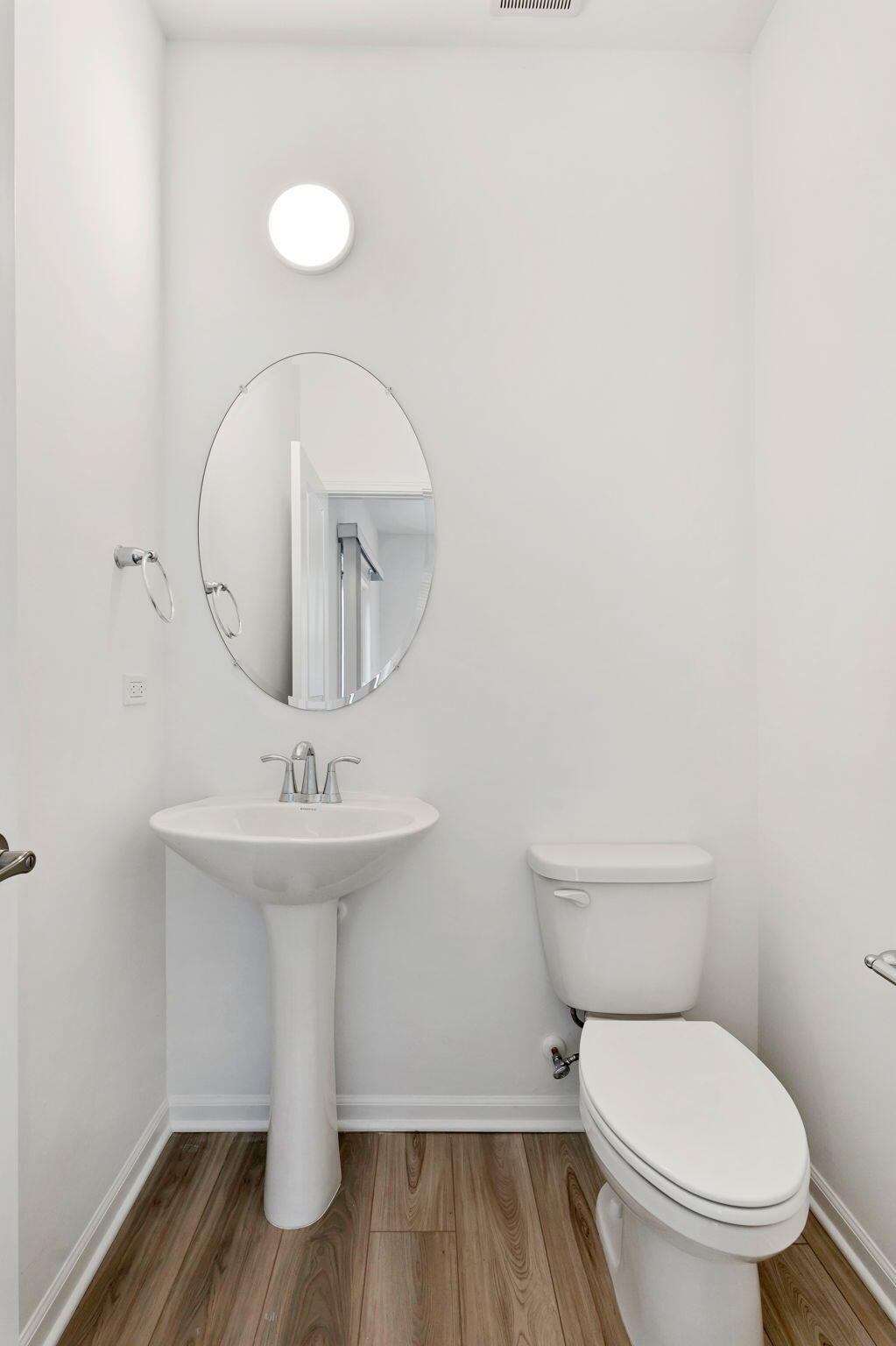 471 East 127th Place Crown Point, IN 46307 - Photo 12 of 27 a white toilet sitting next to a bathroom sink