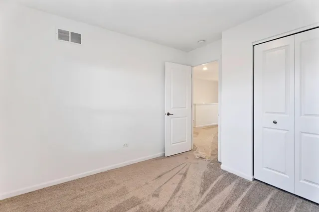a view of a room with wooden floor and closet