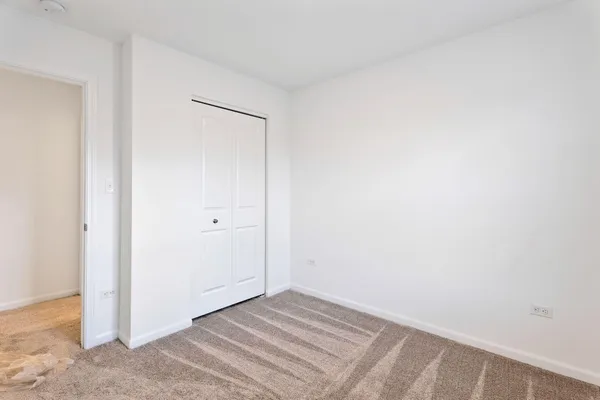 a view of a room with white walls