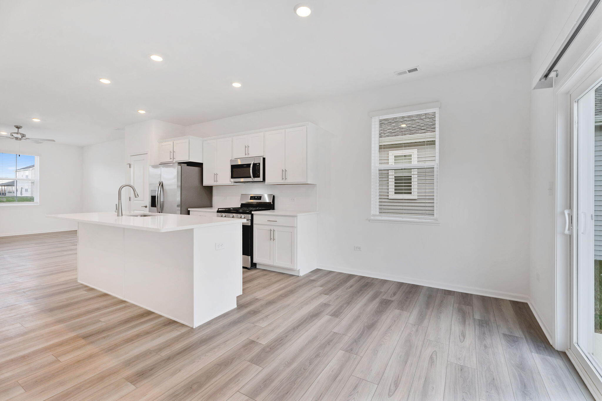 471 East 127th Place Crown Point, IN 46307 - Photo 9 of 27 a view of kitchen with wooden floor and electronic appliances
