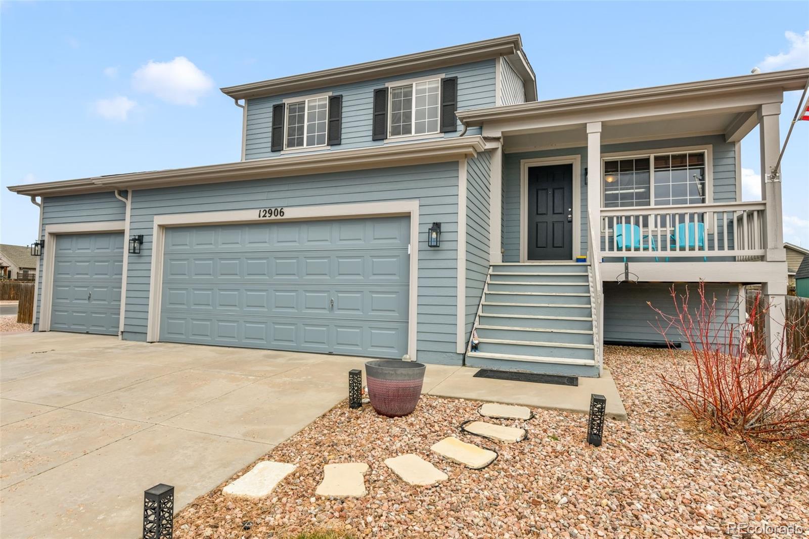 12906 Oakland Hills Road Peyton, CO 80831 - Photo 1 of 50 a front view of a house