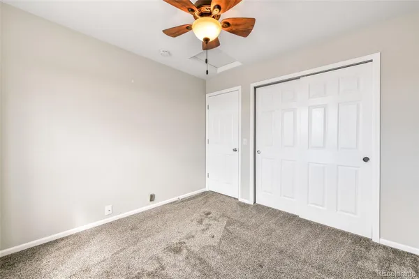 a view of a chandelier fan in a room