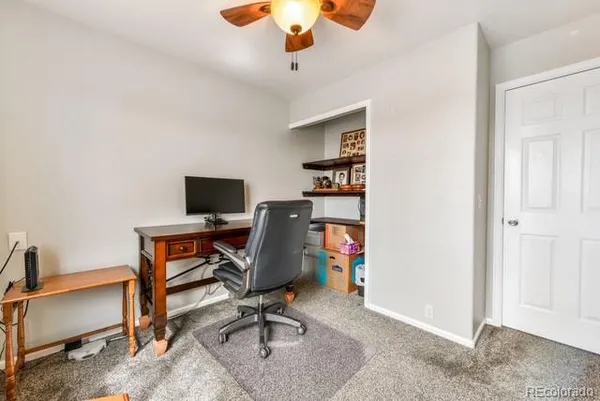 a view of a workspace with furniture