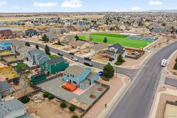 an aerial view of a house with a garden