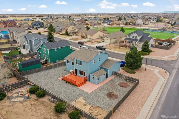an aerial view of a house with outdoor space