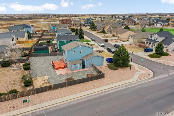 an aerial view of a house with a garden