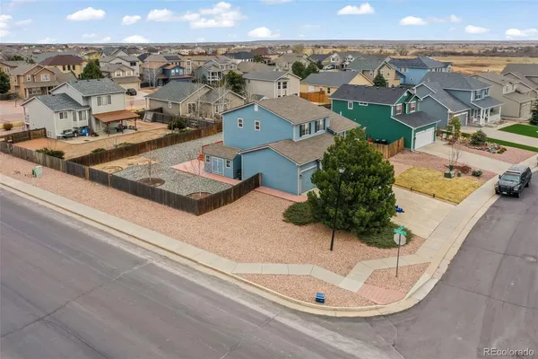an aerial view of residential houses with outdoor space