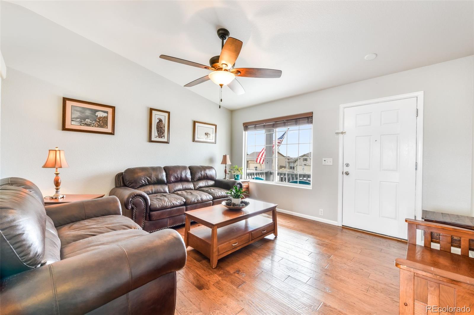 12906 Oakland Hills Road Peyton, CO 80831 - Photo 6 of 50 a living room with furniture and a large window