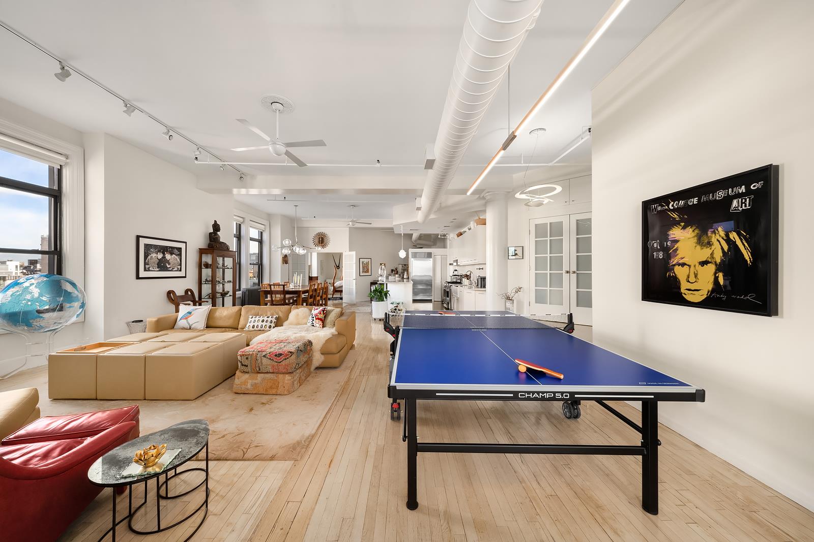 a living room with furniture and kitchen view