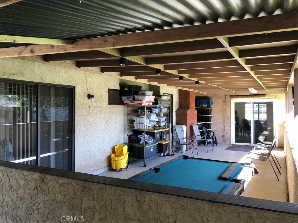 8864 Haskell Street Riverside, CA 92503 - Photo 12 of 18 a room with lots of furniture and white walls