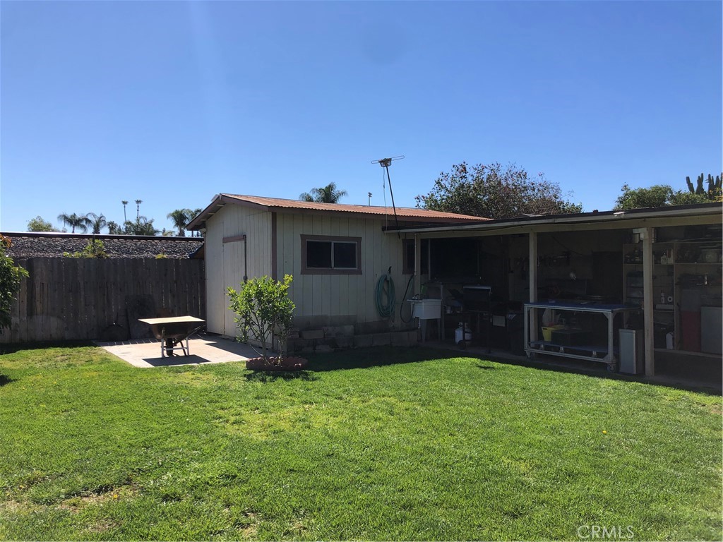 8864 Haskell Street Riverside, CA 92503 - Photo 15 of 18 a backyard of a house with table and chairs
