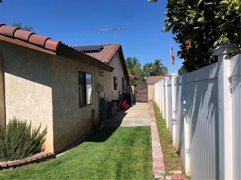 8864 Haskell Street Riverside, CA 92503 - Photo 16 of 18 a view of a house with a yard