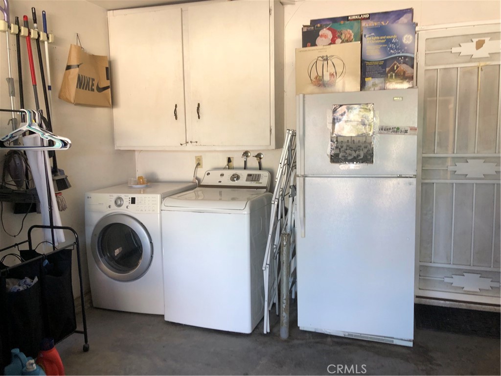 8864 Haskell Street Riverside, CA 92503 - Photo 18 of 18 a utility room with dryer and washer