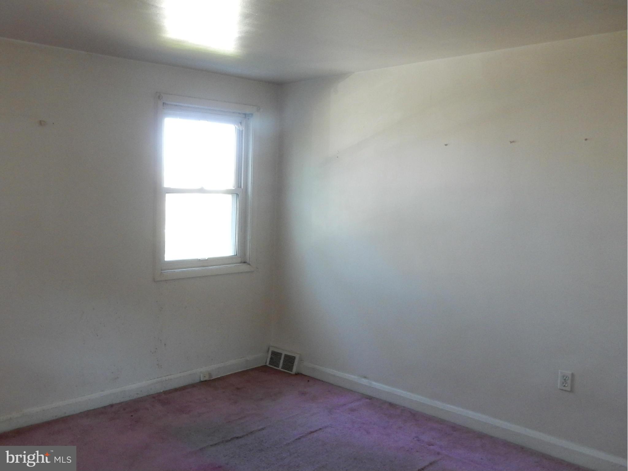1817 Swansea Road Baltimore, MD 21239 - Photo 5 of 8 an empty room with a window