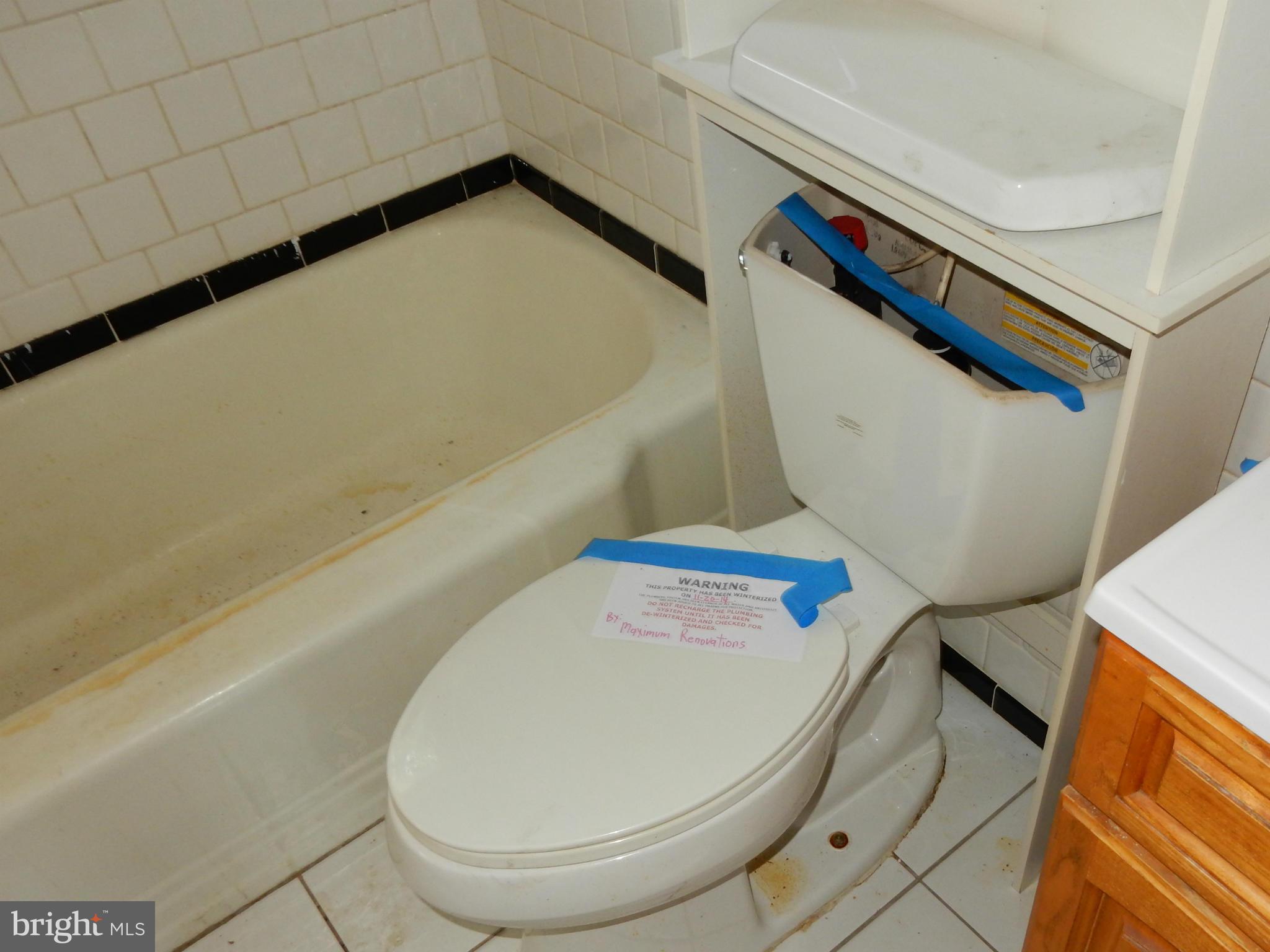 1817 Swansea Road Baltimore, MD 21239 - Photo 7 of 8 a bathroom with a sink and toilet