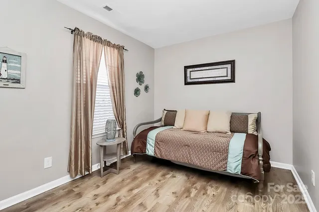 a room with a bed and a window