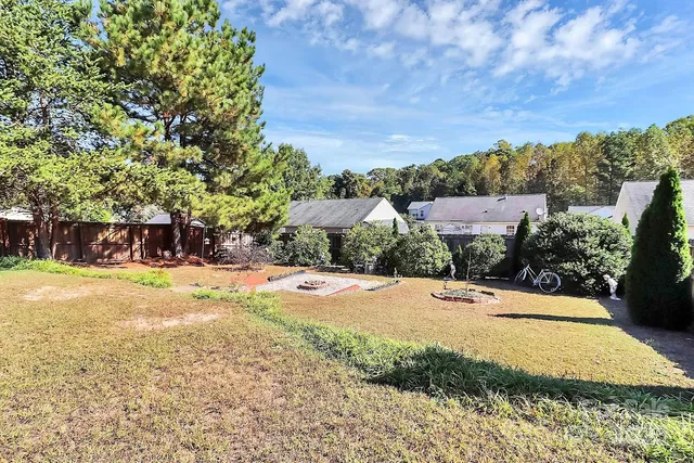 a view of a swimming pool with an outdoor space and seating area